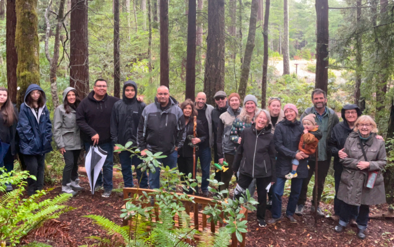 A family gathers by their redwood memorial tree in Better place forests Point arena, California to honor their loved one with a forest memorial
