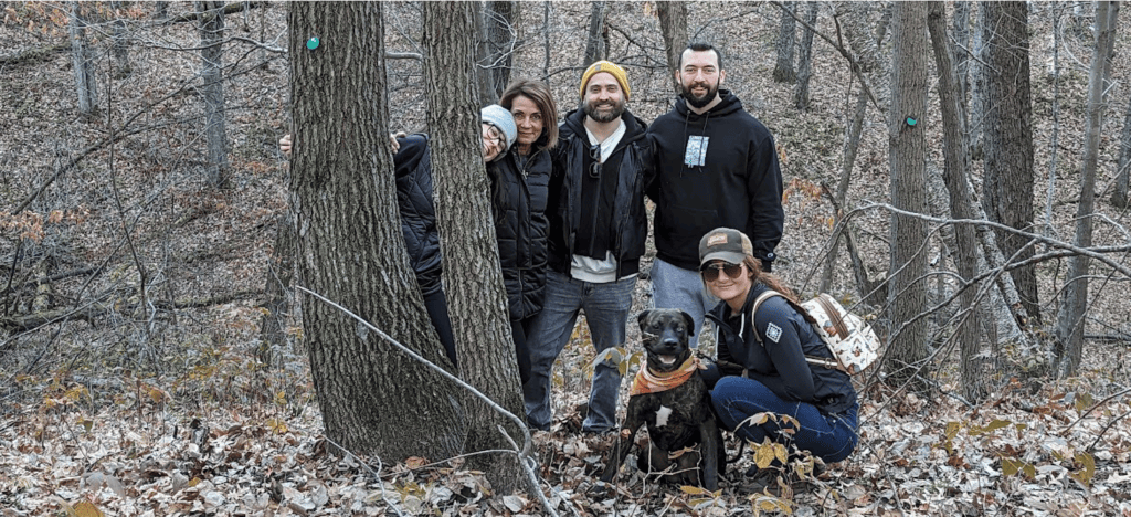 a family by their memorial tree in better place forests St. Croix Valley.