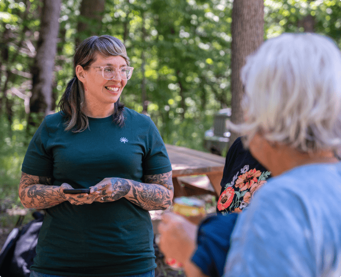 A forest guide assists a customer in to show life as a forest guide